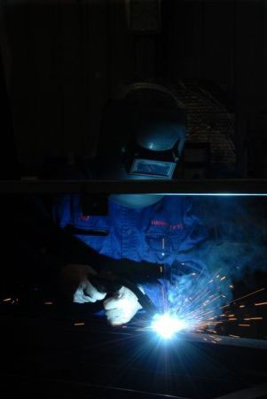 Working on the initial fabrication of the tower in the boilermaking shop